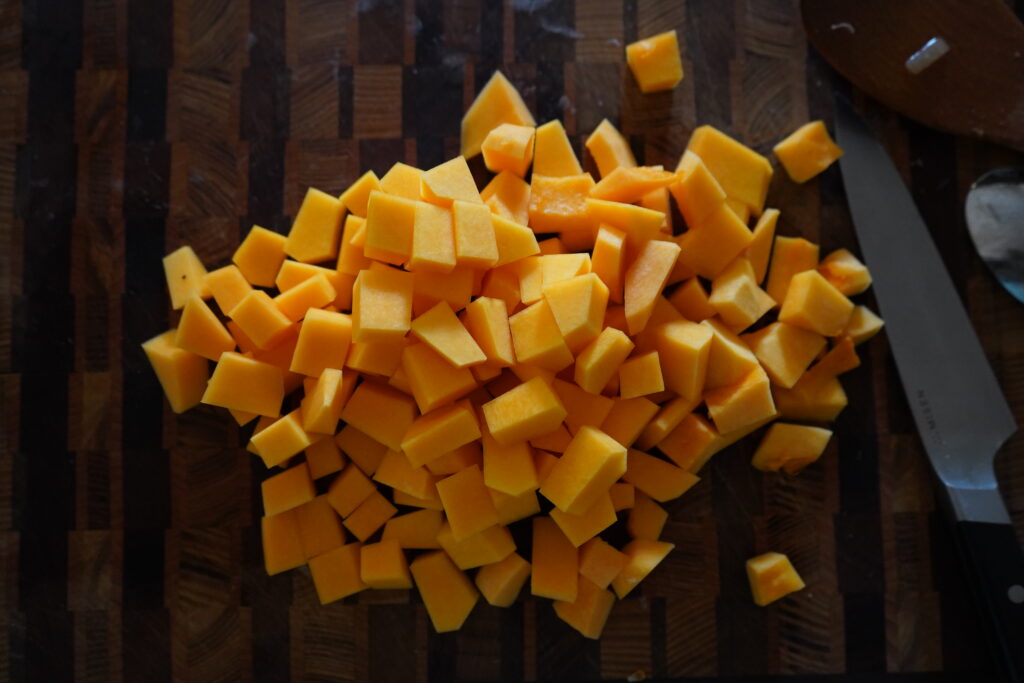 cubbed butternut squash on a cutting board