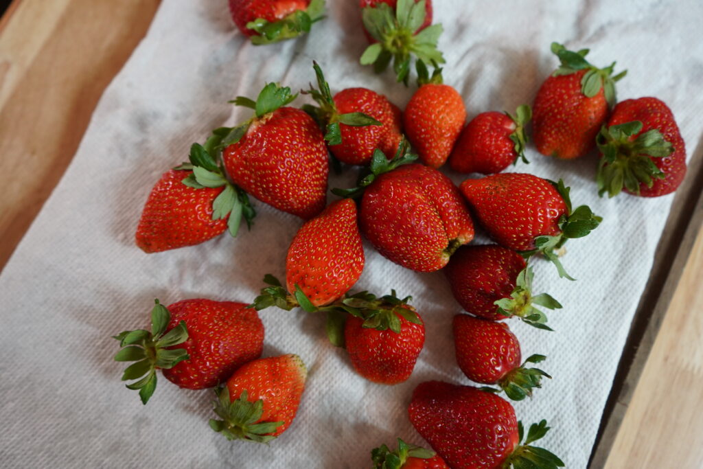 strawberries drying on a paper towel 