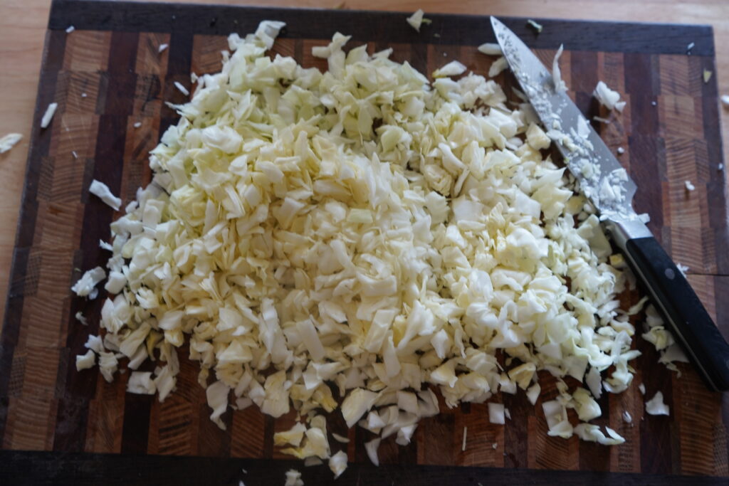 chopped cabbage on a cutting board