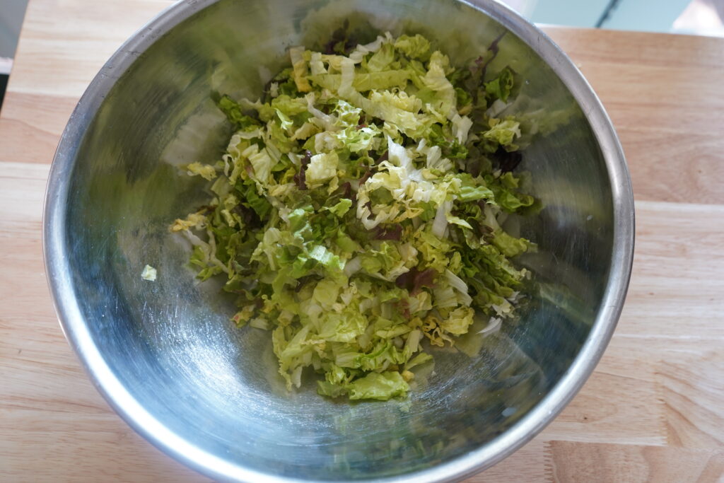 romaine in a stainless-steal bowl