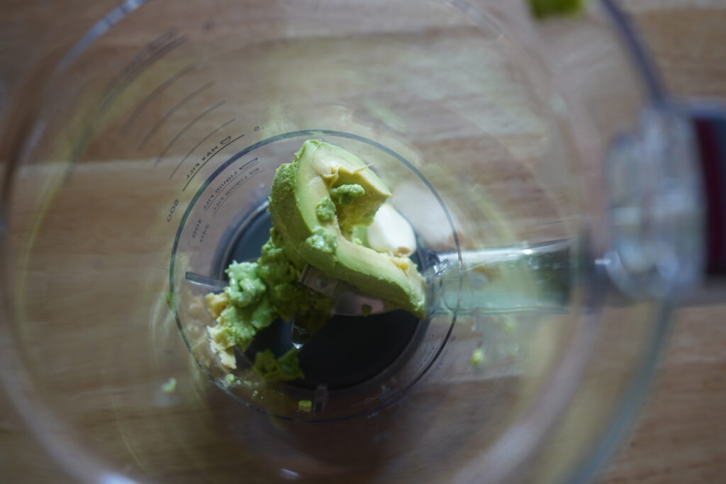 avocado and garlic in a blender