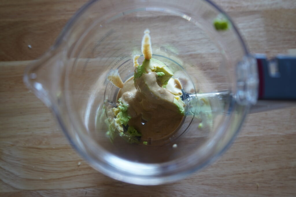 tahini, avocado and garlic in a blender