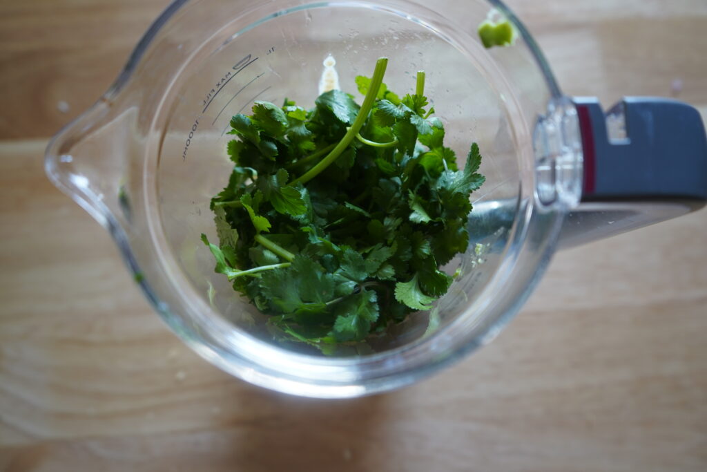 cilantro added to a blender