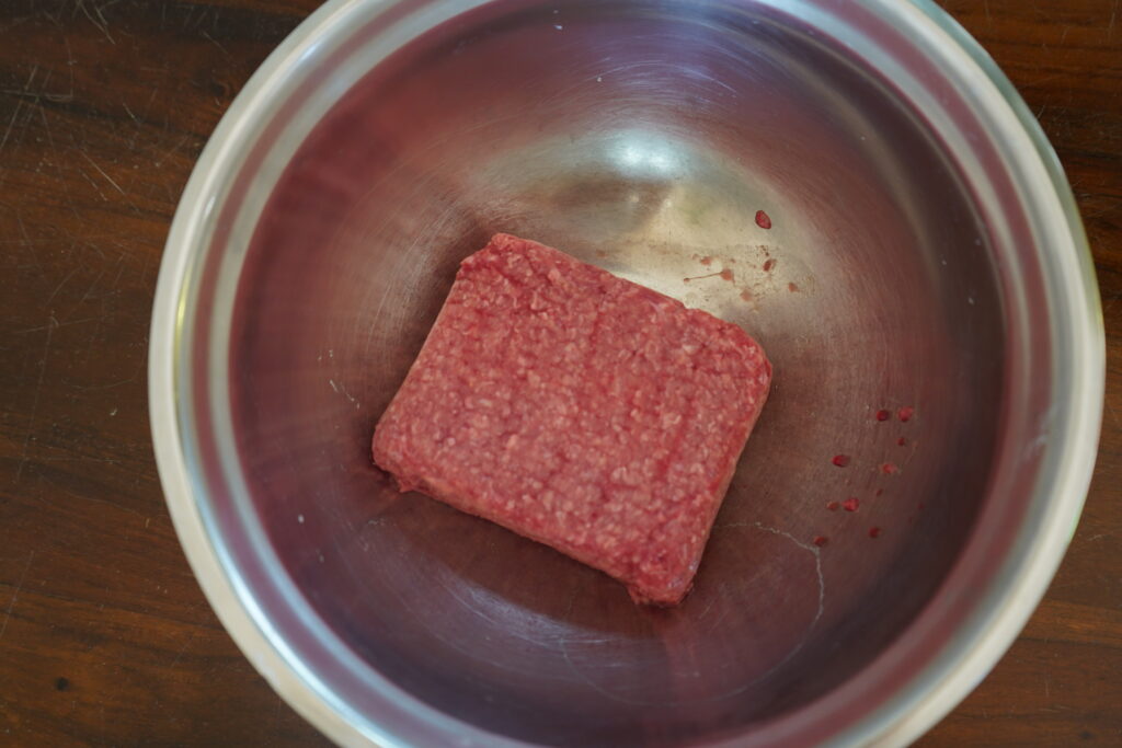 grass-fed ground beef in a mixing bowl