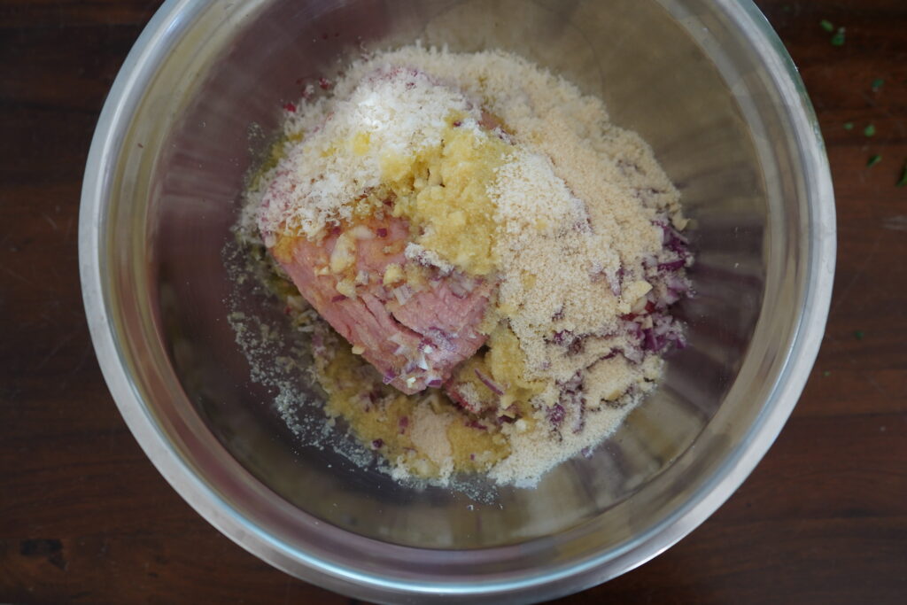 ground meat with parmesan and chopped onions and alomnd flour