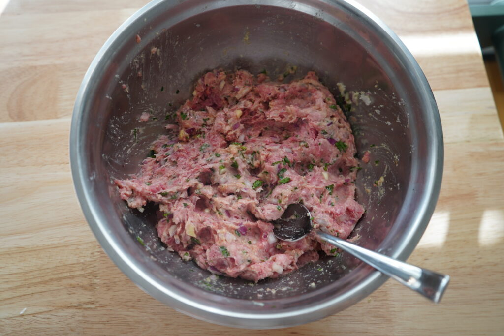 a bowl of a meat mixture on a table