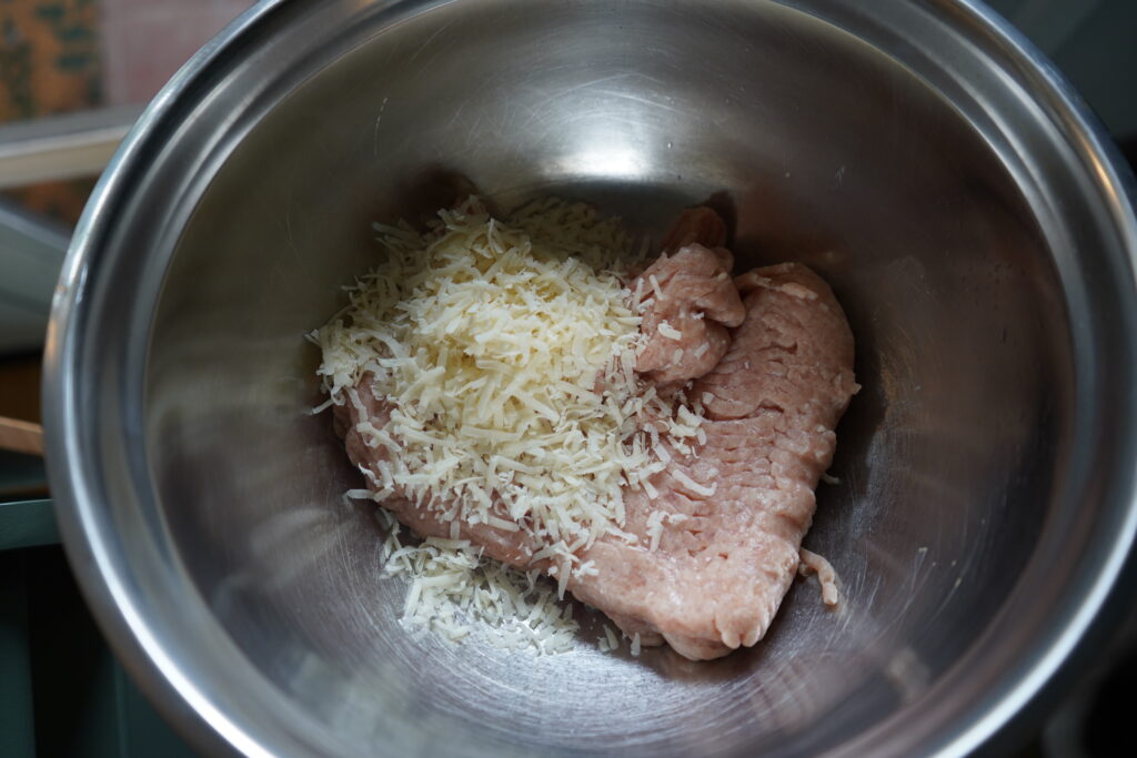 ground chicken and parmesan in a bowl