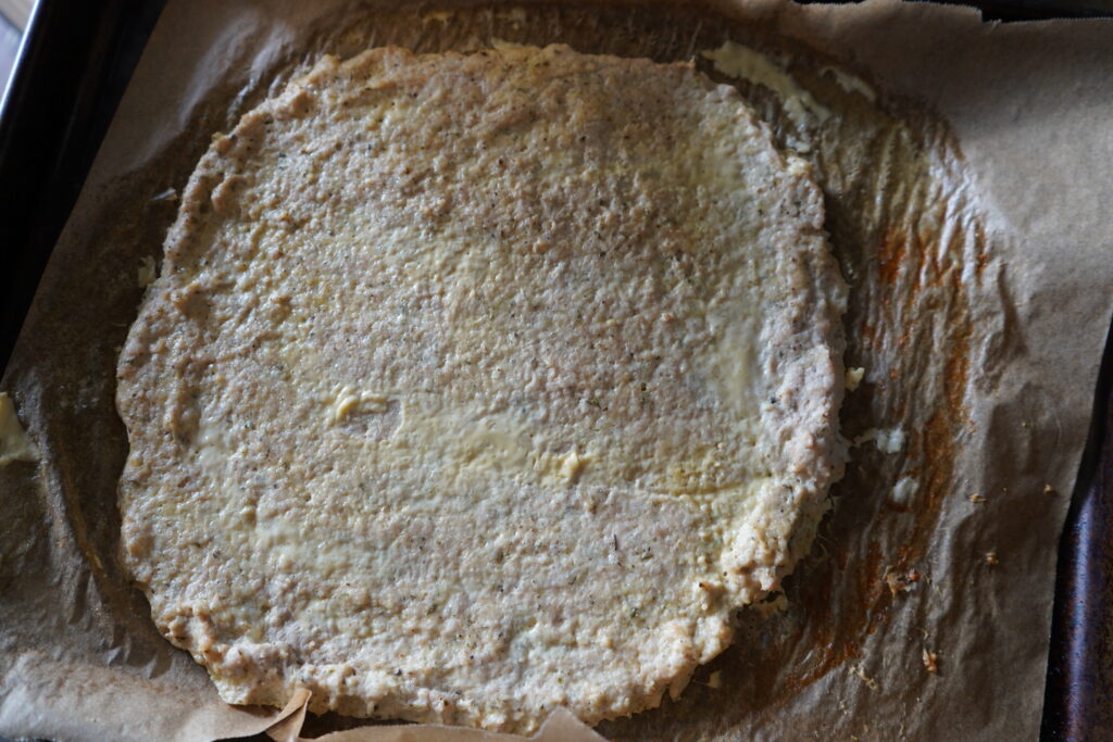 cooked ground chicken on a parchment paper