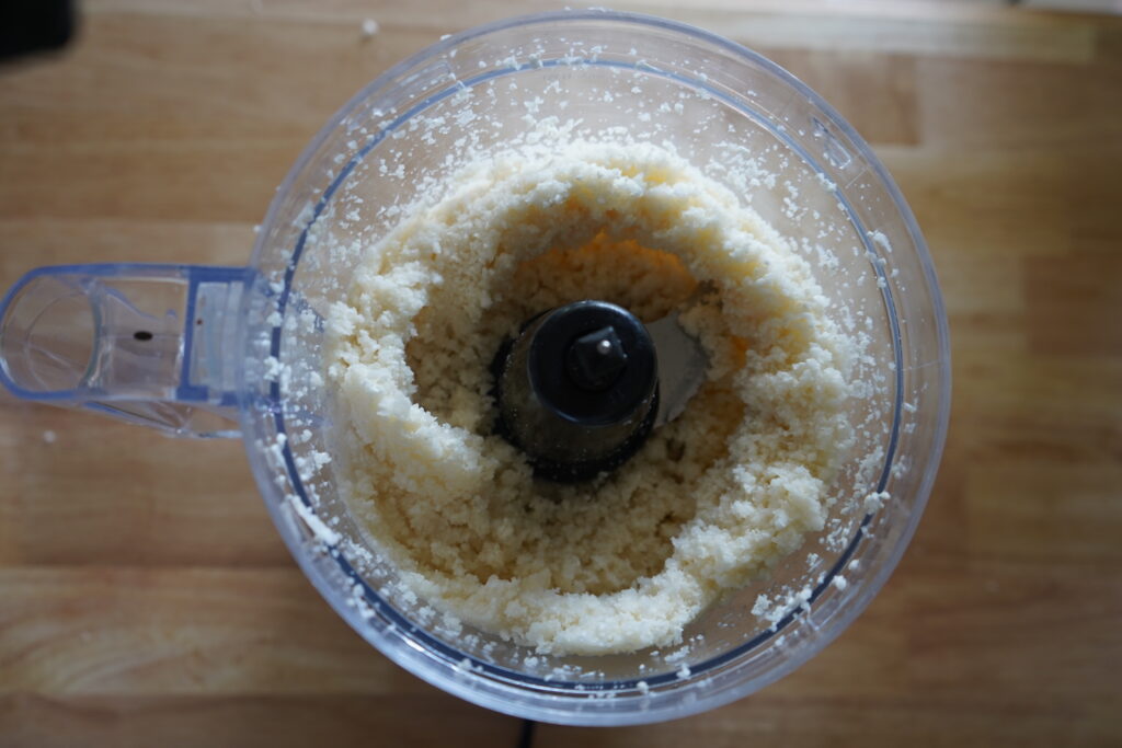 cauliflower inside a food proccesser that has been proccessed