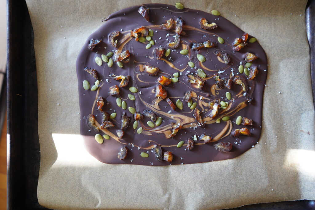 healthy chocolate bark on a parchment lined pan