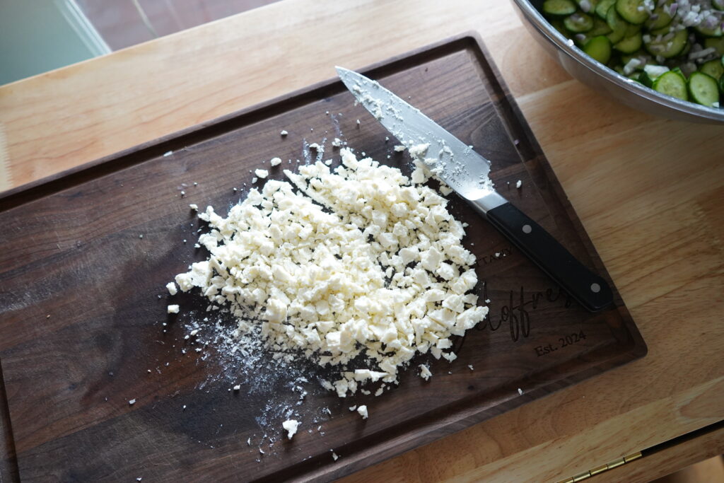 finelt chopped feta on a cutting board