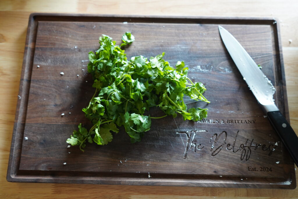 cilantro bunch on a wood cutting baord