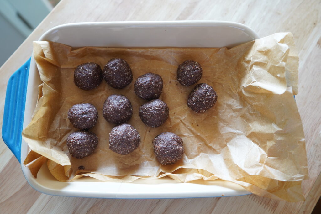 cacao date balls on parchment paper