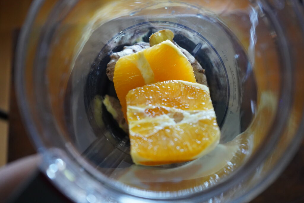 ginger, turmeric and orange in a blender