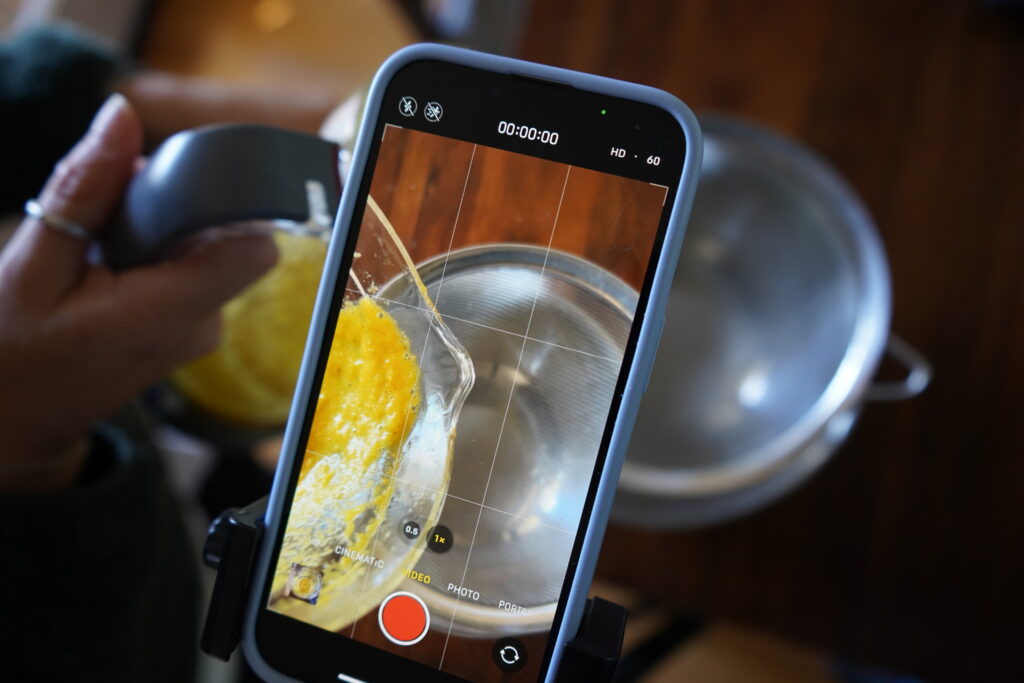 juice about to be strained into a strainer