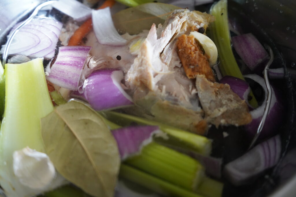 bay leaves and vegtables floatng in an instant pot