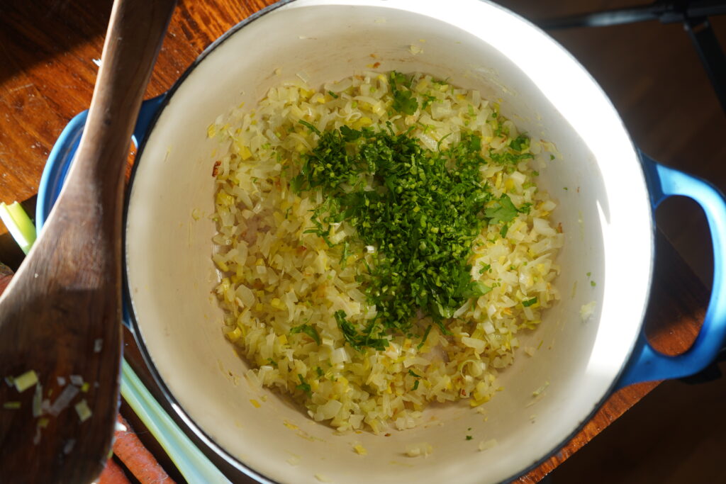 chopped parsley stems added to a soup pot