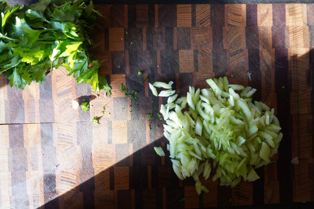 chopped celery on a cutting board