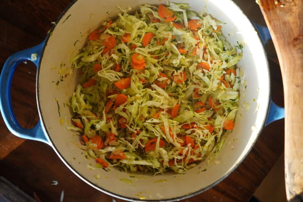 a Dutch oven full of cooked vegetables