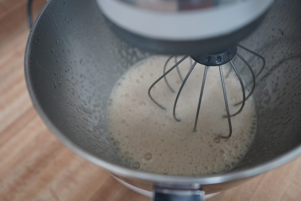 stand mixer mixing a white liquid