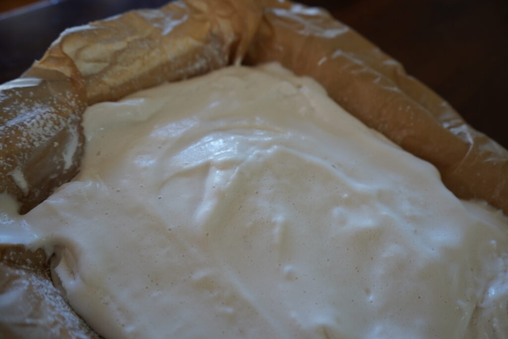 freshly made marshmallow in a parchment lined dish