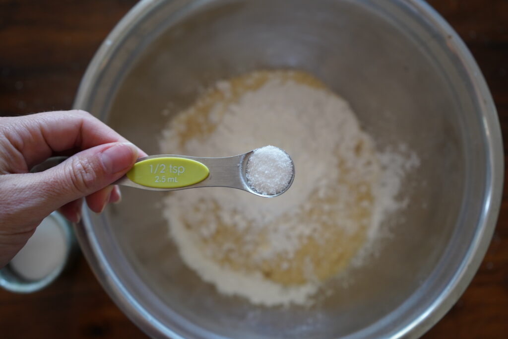 salt being added to a mixng bowl