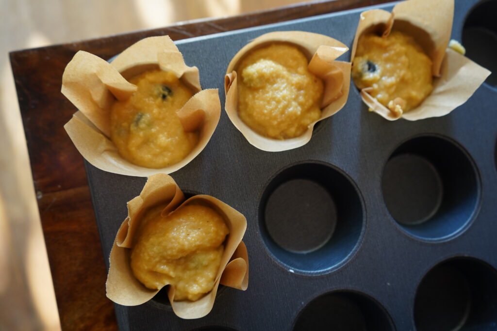 uncooked muffins in a muffin tin