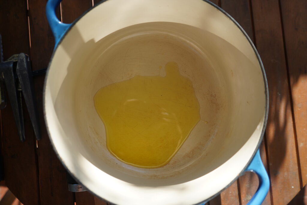 olive oil at the bottom of a dutch oven